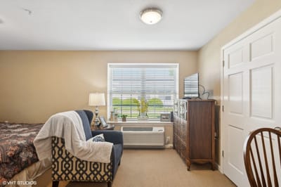 Cozy resident room with a bed and furniture