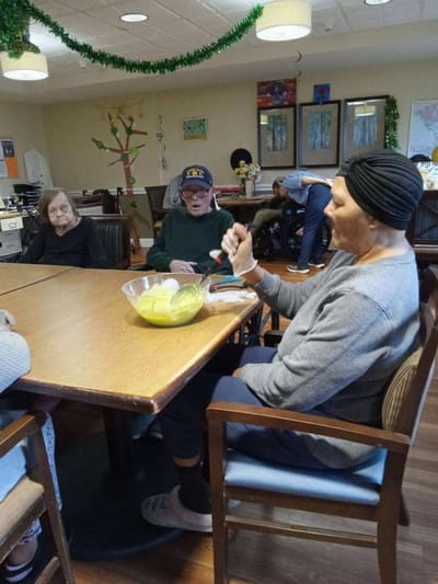 Residents enjoying a meal in a common area