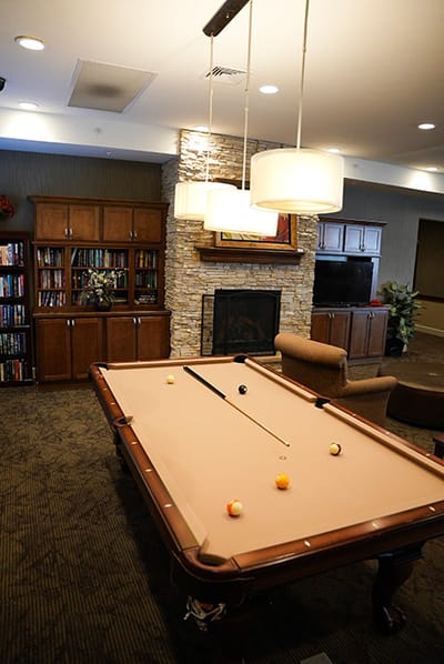Interior view of a common area with a pool table