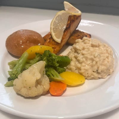 Plate of healthy meal with salmon and vegetables