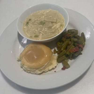 A plate of food featuring chicken and vegetables