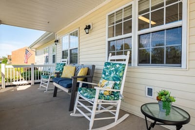 Outdoor seating area with rocking chairs and a view