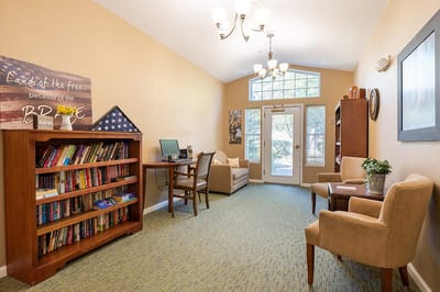 Interior common area with seating and bookshelves