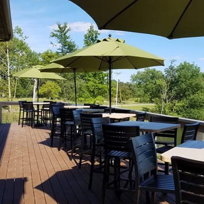 Outdoor dining area with umbrellas on a wooden deck