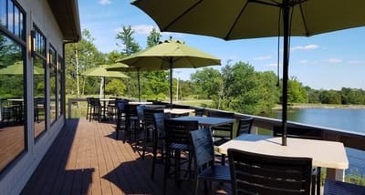 Outdoor dining area with view of a lake