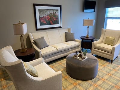 Cozy common area with seating and decorative art