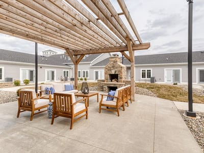 Outdoor seating area with a fireplace