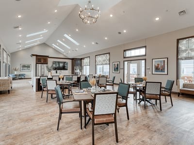 Bright dining area with tables and chairs
