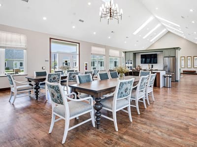 Bright dining room with modern decor and large windows