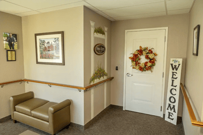 Welcoming entrance to a facility's interior with seating