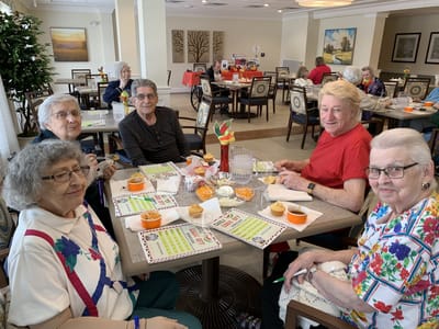 Residents enjoying a meal together in a common area