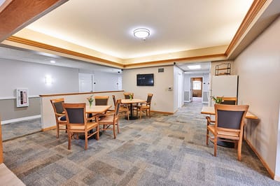 Bright common area with tables and chairs