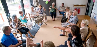 Residents participating in a group activity in a common area