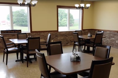 Dining area with empty tables and chairs