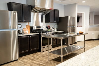 Modern kitchen area with stainless steel appliances