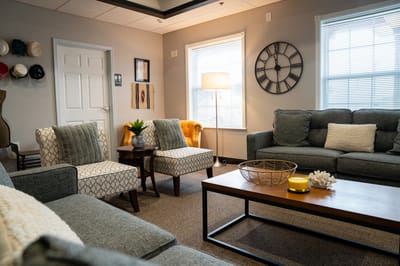 Cozy common area with comfortable seating and natural light