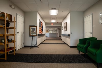 Interior hallway with art and seating area