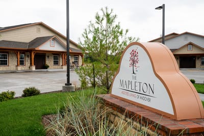 Exterior sign of The Mapleton Assisted Living facility