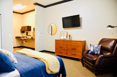 Cozy resident room with modern furnishings and kitchenette