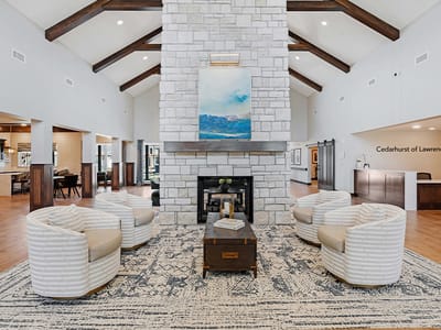 Welcoming lounge area with comfortable seating and decorative fireplace