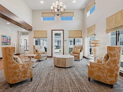 Bright common area with seating and natural light