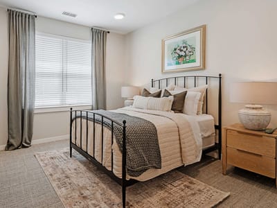 Cozy interior bedroom with a nicely made bed