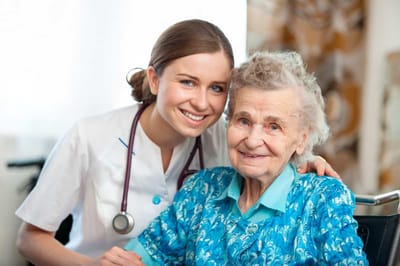 Caregiver with a resident in a bright interior