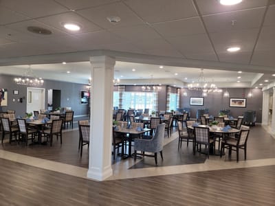 Bright dining room setup with tables and chairs