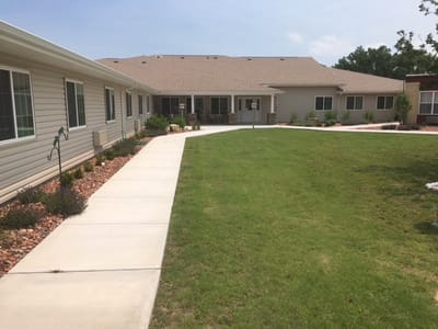 Pathway through landscaped outdoor area of a retirement facility