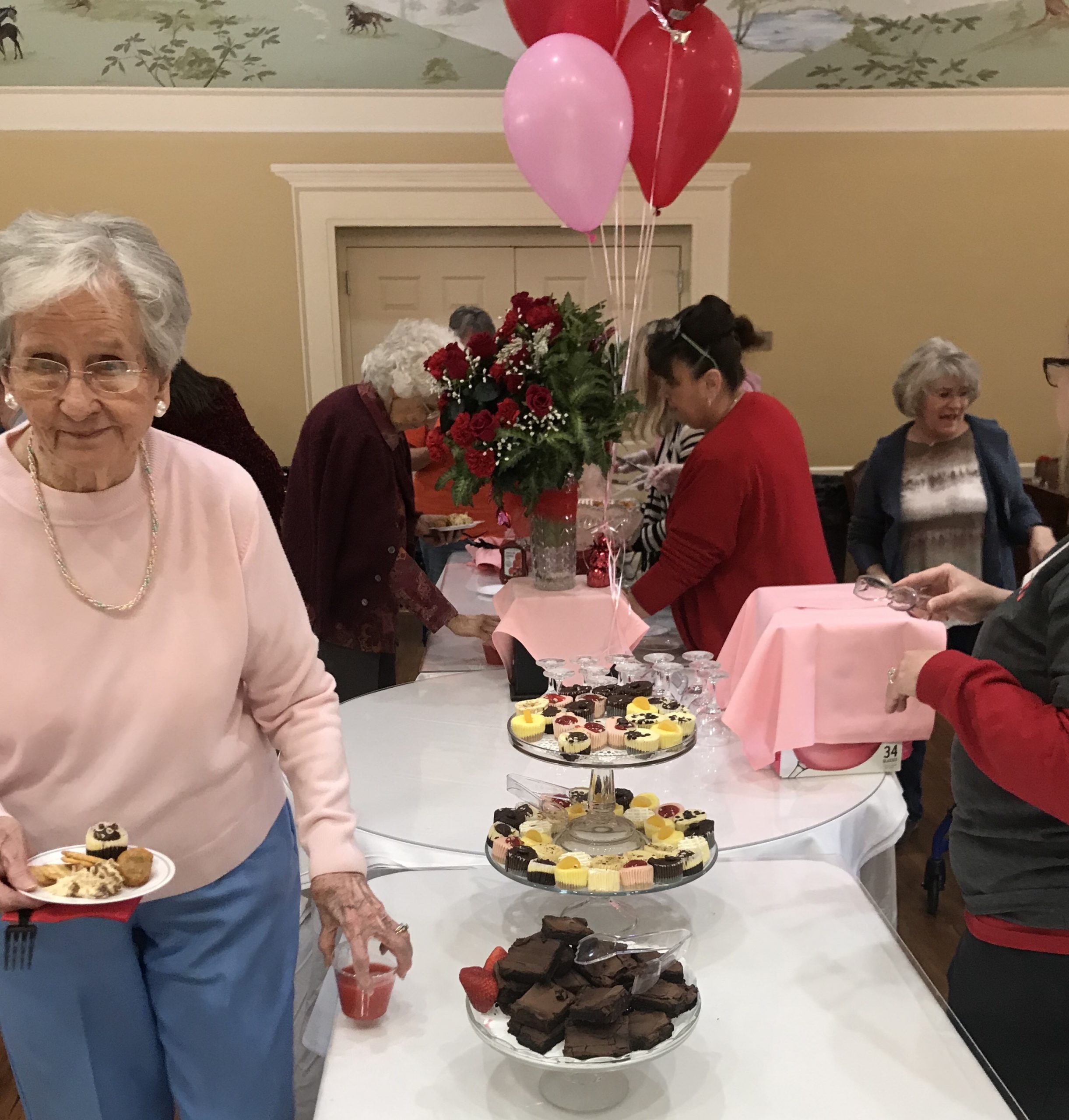 Residents celebrating with desserts and decorations