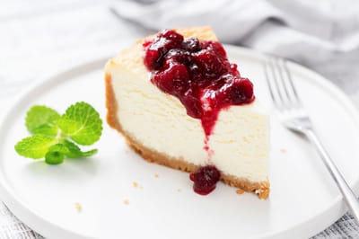 Slice of cheesecake topped with berries