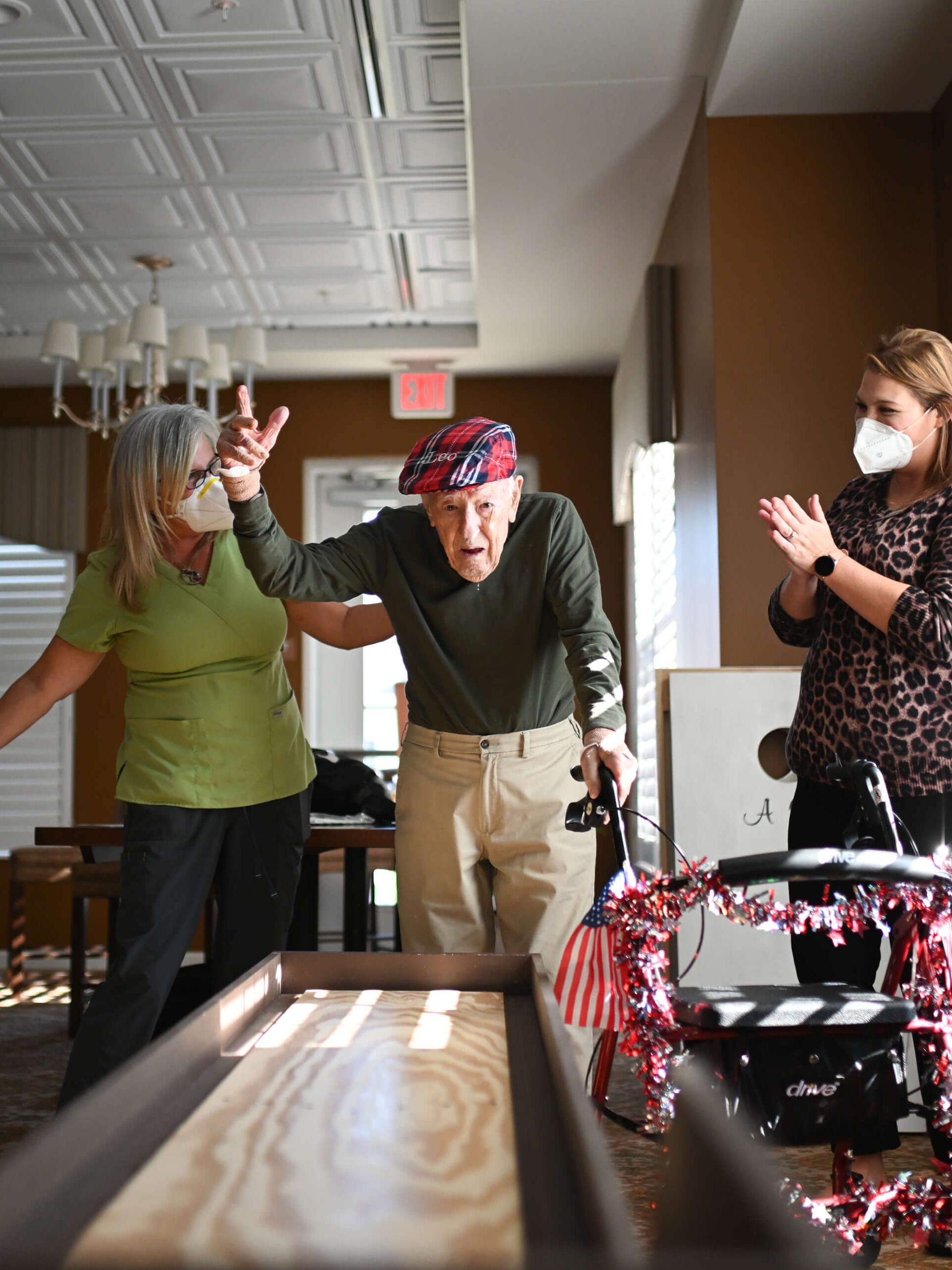 Residents and staff engaging in an indoor activity