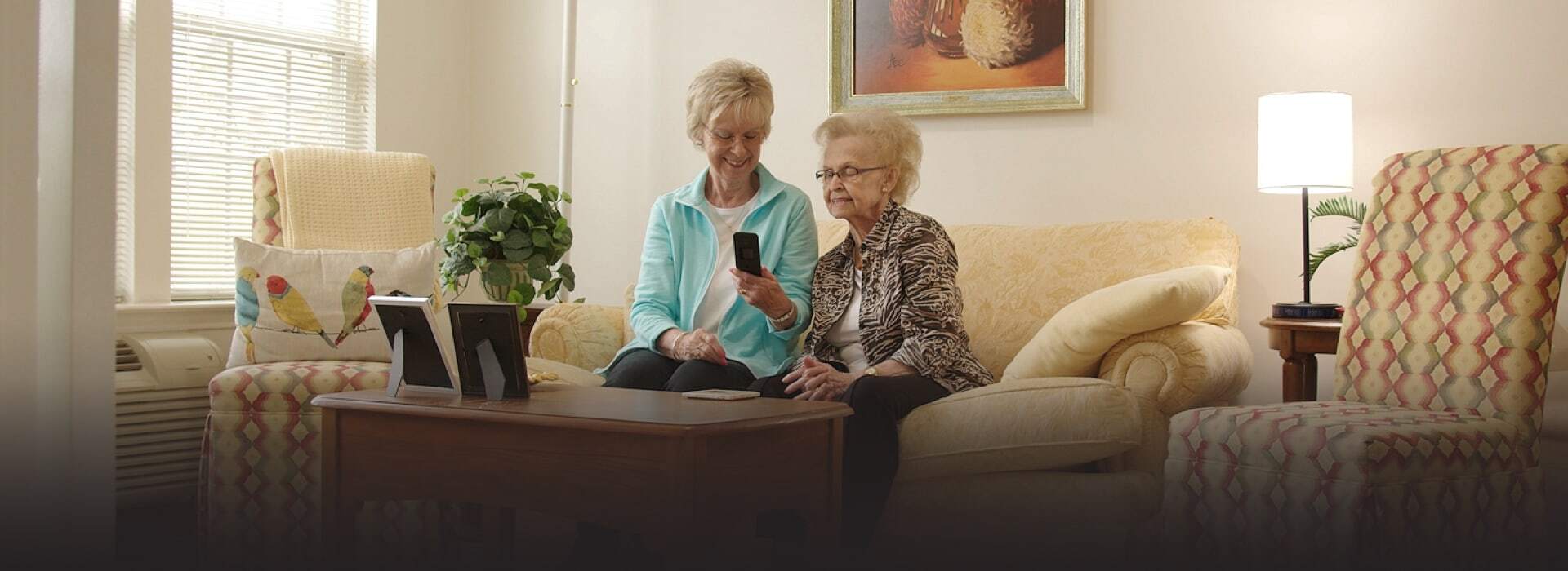 Staff member assisting a resident in a comfortable living space
