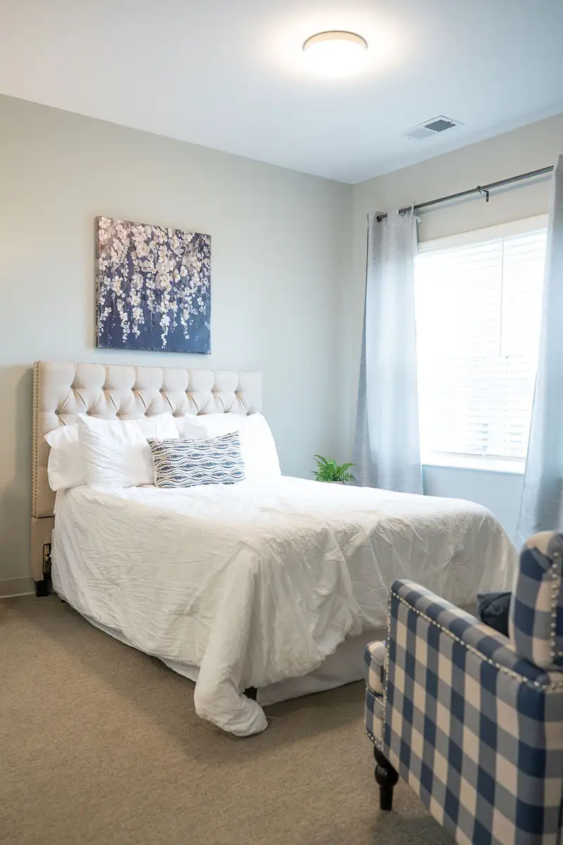 Cozy resident room with a large bed and window