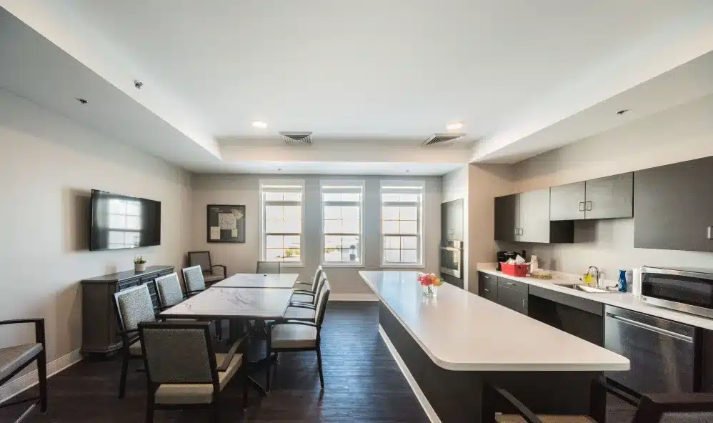 Bright common area with dining and kitchen facilities