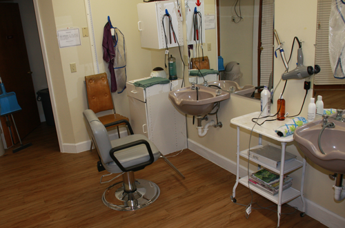 A salon area with a hair cutting station