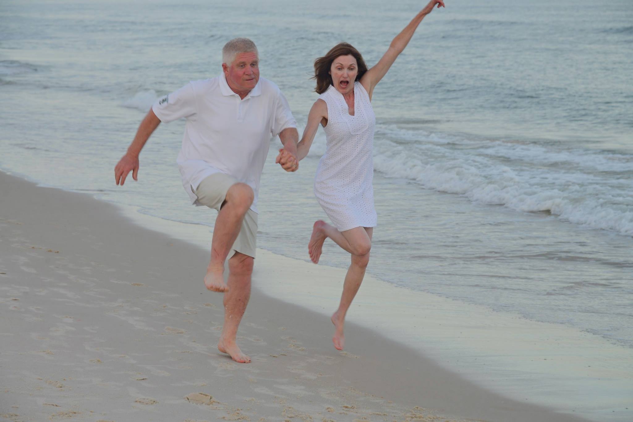 Couple playing joyfully at the beach