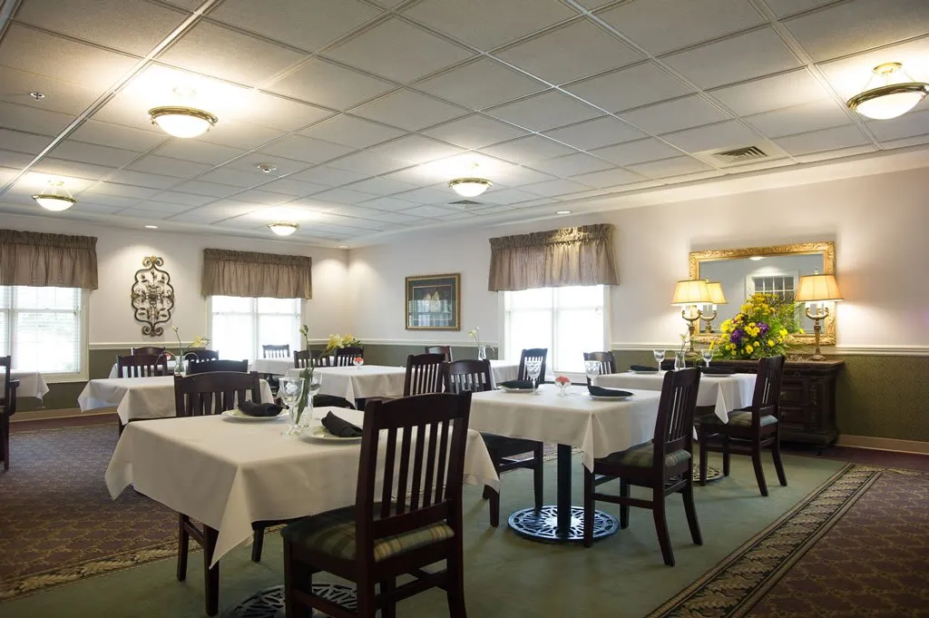 Bright dining room with tables set for meals