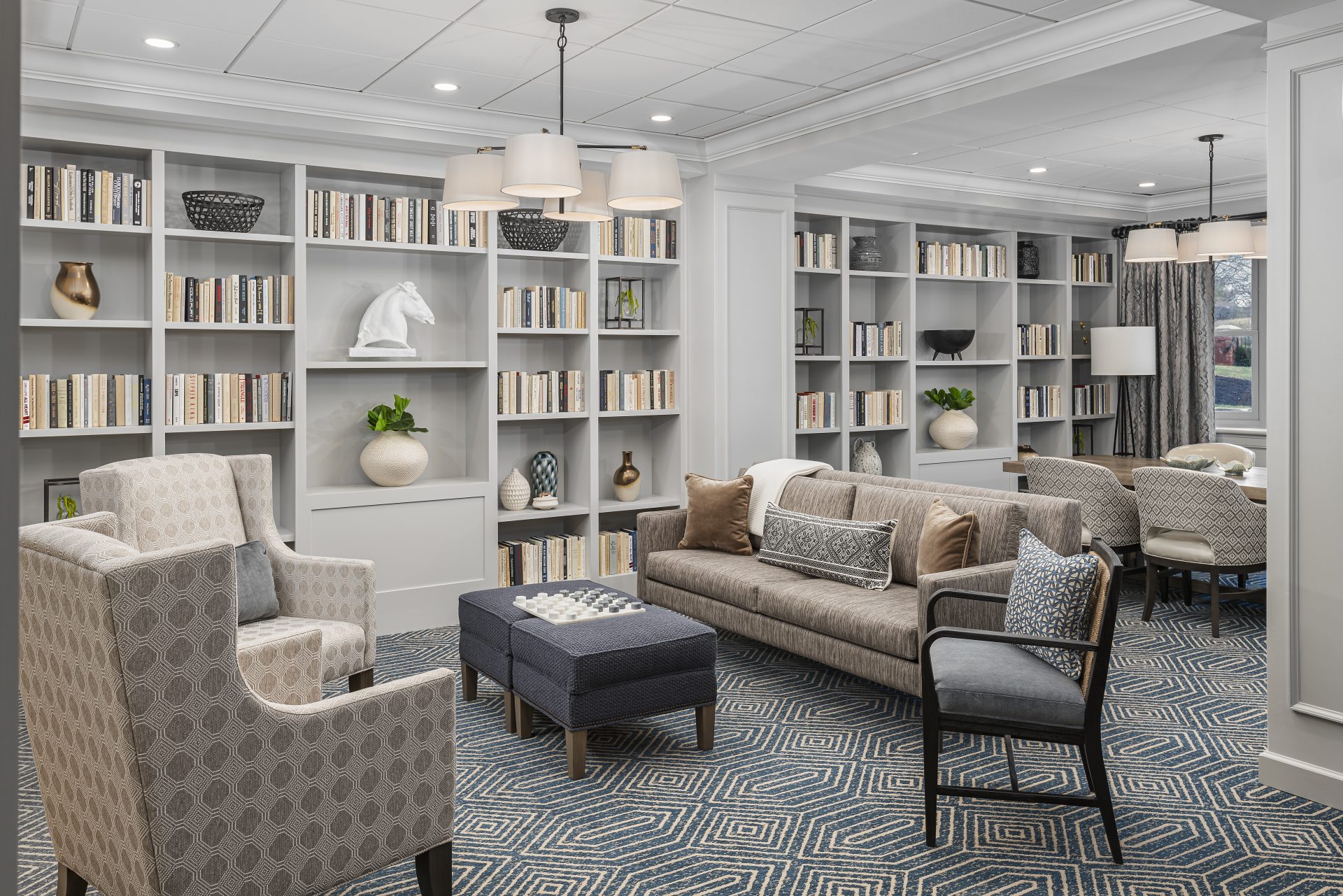Interior view of a cozy common area with bookshelves