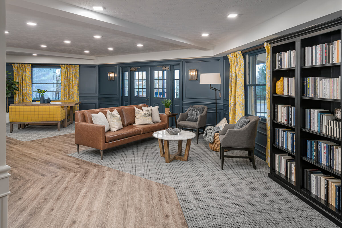 Cozy common area with seating and bookshelves