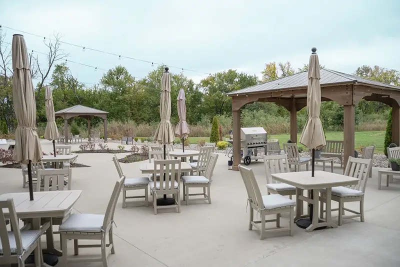 Outdoor seating area with tables and umbrellas