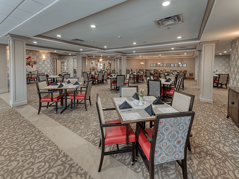 Interior view of a dining room with tables and chairs