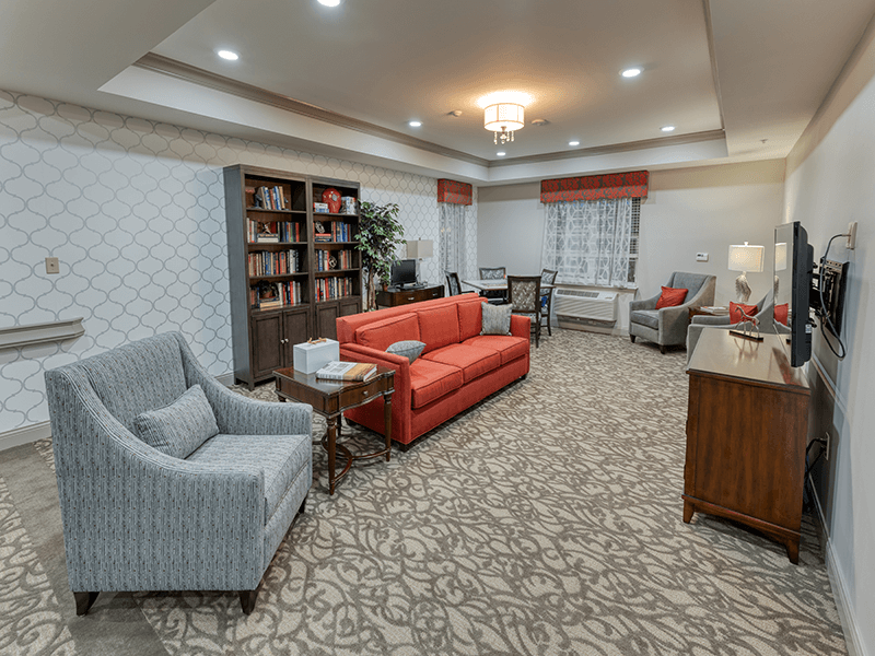 Interior common area with seating and bookshelves
