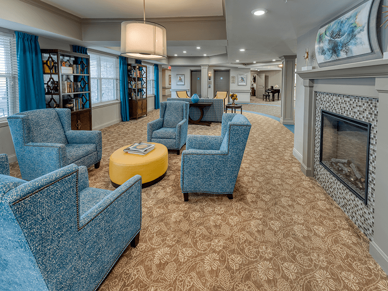 Interior common area with seating and a fireplace