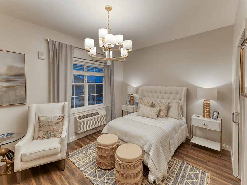 Cozy resident room with a bed and seating area