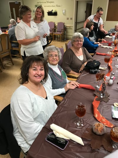 Residents enjoying a meal together in the dining room