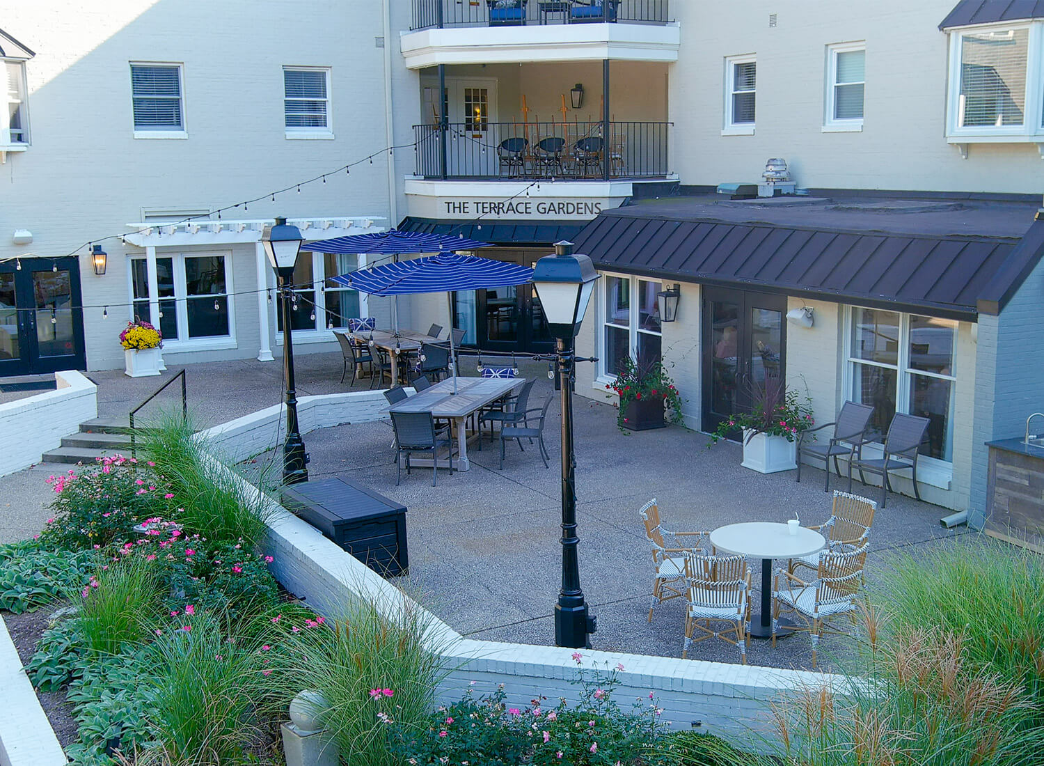 Outdoor seating area with tables and umbrellas