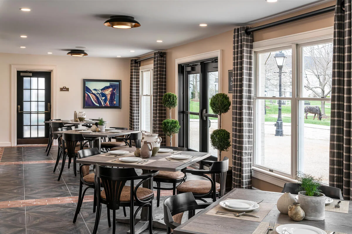 Bright dining area with tables and views to outdoor space