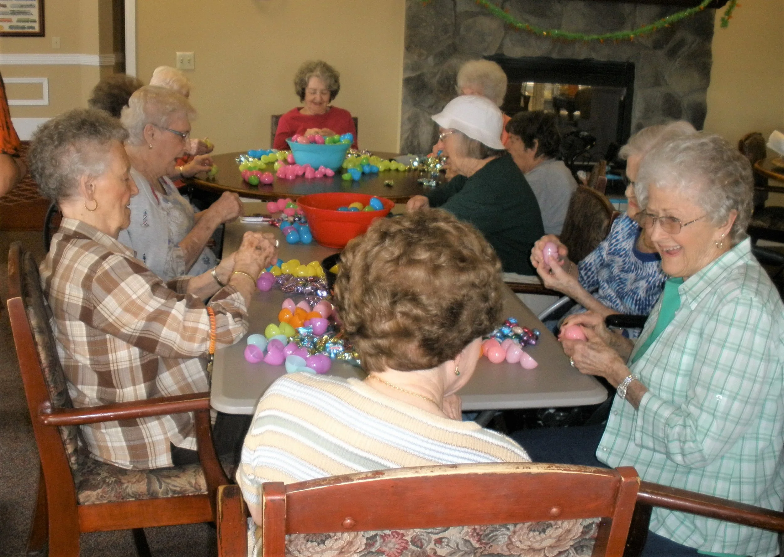 Residents engaging in an Easter egg decorating activity