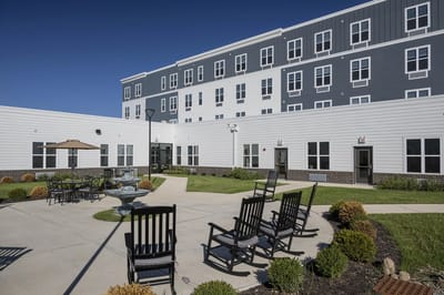 Exterior view of a resident courtyard with seating